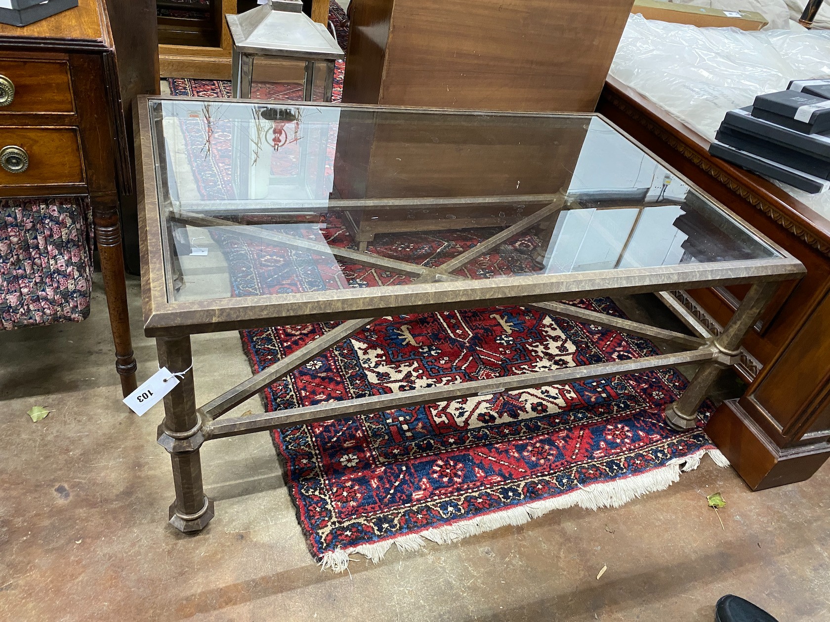 A contemporary rectangular glass top bronzed metal frame coffee table, width 120cm, depth 76cm, height 51cm